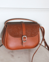 Bolsa It-bag "Le Mignon" de cuero marrón estampado